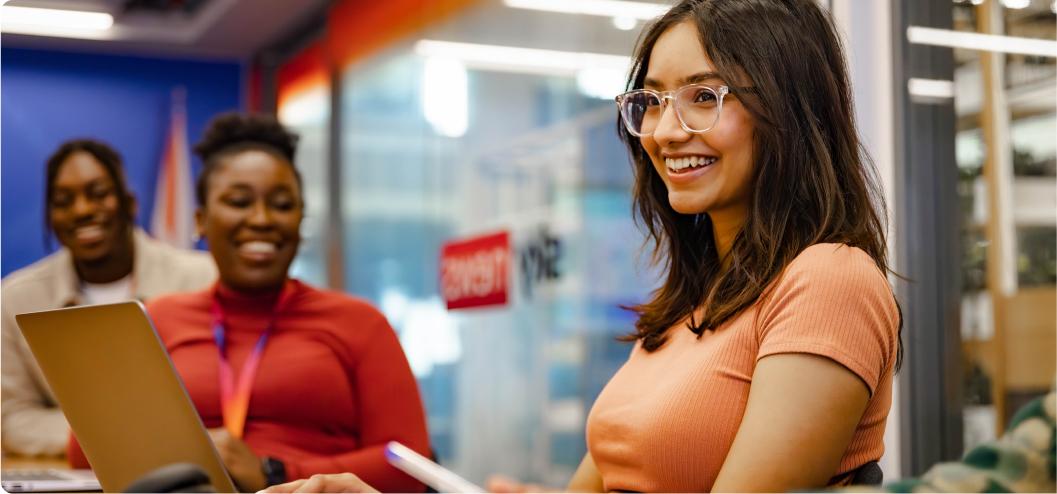 girl in glasses with long brown hair smiling