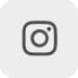 Instagram logo in a simple black outline of a camera on a light grey square background.